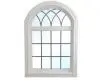 Arched window with decorative grid design.