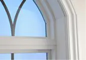 Arched window with blue sky view.