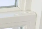 White window frame with latch detail.