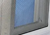 Window with a mesh insect screen installed.