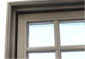 Gray window frame with blue sky background.