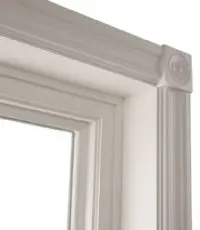 White decorative window frame corner detail.
