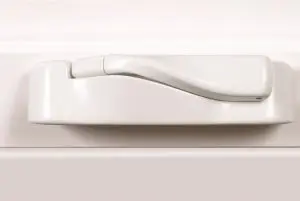 White window lock handle on a frame.