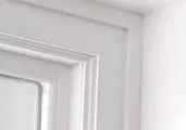 White door and wall corner detail.
