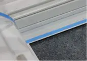 Aluminum frame with blue trim and carpet.