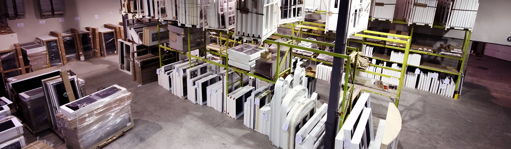 Warehouse with shelves of window frames.