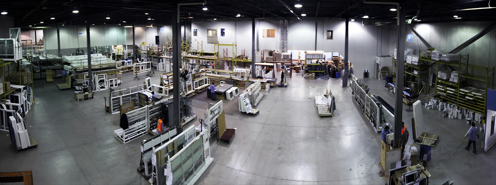 Factory interior with machinery and assembled products.
